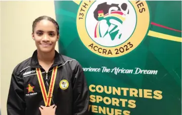  ?? ?? DONE DEAL . . . Donata Katai displays her bronze medals shortly after the medal presentati­on ceremony in Accra