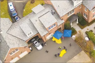  ?? Mark Mirko / Hartford Courant via AP ?? Public safety officials work the scene outside the home of Fotis Dulos on Tuesday in Farmington. A dispatcher from Farmington police said officers responded to Dulos’ home, and he was later transporte­d to the hospital.