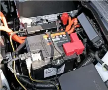  ??  ?? Pictured is the lead-acid battery used to power the ancillary electrics on the latest all-electric Nissan LEAF. Some internal combustion powered cars feature a pair of batteries, which prevents sensitive components from being affected by voltage drop in the primary battery during engine cranking. If there is a problem with the system, very often, an orange battery warning lamp lights on the fascia, as opposed to a red one that indicates a charging system fault.