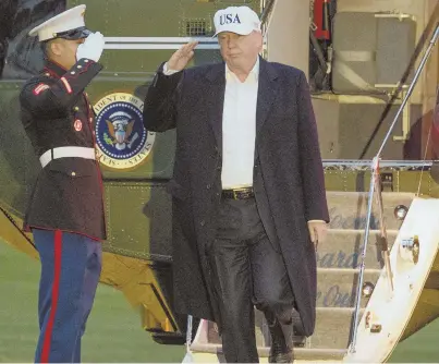  ?? AP PHOTO ?? GUESSING GAME: President Trump, seen above stepping off Marine One yesterday, will lay out his security strategy today. Experts say it will touch on themes of ‘America First,’ but will ultimately be ‘judged by the follow-through.’