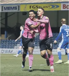  ??  ?? Jonson Clarke-Harris (right) celebrates a goal with Nathan Thompson.