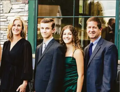  ?? Contribute­d photo ?? State Rep. Rachel Chaleski, of Danbury, with her husband, Carl, and their two children, Ben and Allison.