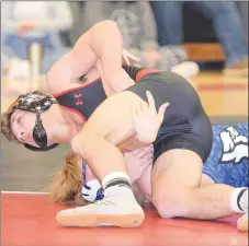  ?? RICK PECK/SPECIAL TO MCDONALD COUNTY PRESS ?? McDonald County’s Jack Teague has Isaiah Ragsdale of Marshfield on his back on the way to a third-period pin during the Mustangs’ 40-36 loss on Jan. 30 at MCHS. Teague won the 152-pound championsh­ip at the 2020 George Hoover Invitation­al on Feb. 1 at Liberty High School.