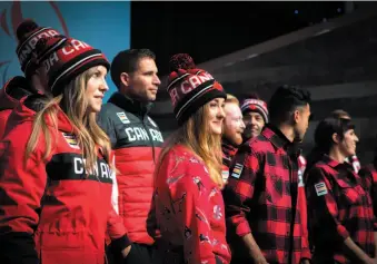  ?? CP PHOTO ?? Olympic hopefuls for 2018 show off Hudson Bay Company’s new line of Olympic gear at the Eaton Centre in Toronto on Tuesday.