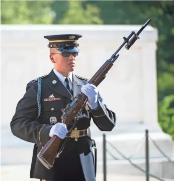  ?? JACK GRUBER/USA TODAY ?? The changing of the guard at the Tomb of the Unknown Soldier is a somber, elaborate ritual.