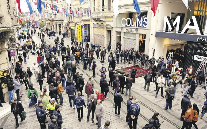  ?? EDITOR YUSUF ZİYA DURMUŞ ?? People gather around a memorial placed on the spot of the attack, Istanbul, Türkiye, Nov. 14, 2022.