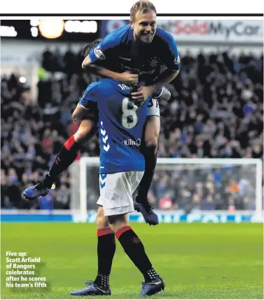  ??  ?? Five up: Scott Arfield of Rangers celebrates after he scores his team’s fifth