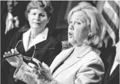  ?? EVAN VUCCI, AP ?? Sen. Mary Landrieu, D- La., center, is getting support for a bill that would allow people to keep their current health insurance plans.