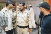  ?? AP ?? Abdul Hakim Belhaj, centre, the rebel military commander is suing the British government over his detention in Thailand