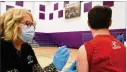  ?? BILL LACKEY / STAFF ?? Alden Prohaska gets the vaccine from Hope Stickley Thursday at Mechanicsb­urg High.