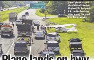  ??  ?? Small plane sits on shoulder of Sunrise Highway in Bellport, L.I., on Wednesday after using the road as a long runway.