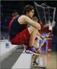  ?? STEVE HELBER — THE ASSOCIATED PRESS ?? University of Richmond basketball player Grant Golden watches practice at the school Monday in Richmond, Va. Golden had no idea what was happening when he collapsed while running up the court. The freshman forward at Richmond got dizzy and went down...