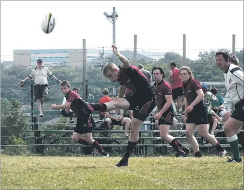  ?? — Submitted photo/paula Dalton ?? Newfoundla­nd Statoil U18 scrumhalf Tony Pomroy gets his leg into this kick during the Eastern Canadian male under-18 gold-medal final against New Brunswick Sunday at the Swilers Complex in St. John’s. Newfoundla­nd won 27-11.