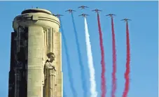  ?? DAVE KAUP, AFP/GETTY IMAGES ?? Aircraft with the Patrouille de France fly by the Liberty Memorial at the National World War I Museum and Memorial in Kansas City, Mo. Thousands attended the ceremony Thursday that marked the centennial of the U.S. entry into the war.