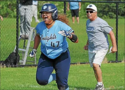  ?? GENE WALSH — DIGITAL FIRST MEDIA ?? North Penn’s Elia Namey celebrates her grand slam during the Knights’ District 1-6A second round game against Quakertown Wednesday.