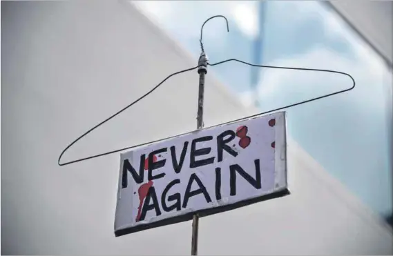  ?? Photo: Robyn BECK/AFP ?? More than pro-choice: A hanger carried during a rally to protest new restrictio­ns on abortions in California.