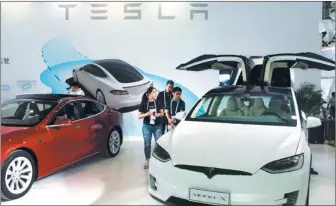  ?? WANG QIMING / FOR CHINA DAILY ?? A Tesla model X on display at a new energy expo in Nanjing, Jiangsu province.