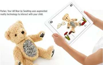  ??  ?? Parker, Your AR Bear by Seedling uses augmented reality technology to interact with your child.