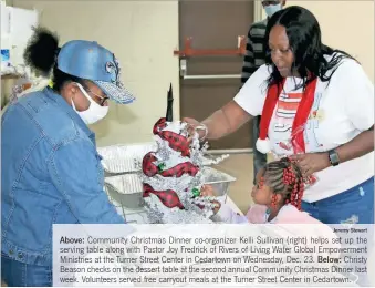  ?? Jeremy stewart ?? above: Community Christmas Dinner co-organizer Kelli Sullivan (right) helps set up the serving table along with Pastor Joy Fredrick of Rivers of Living Water Global Empowermen­t Ministries at the Turner Street Center in Cedartown on Wednesday, Dec. 23. below: Christy Beason checks on the dessert table at the second annual Community Christmas Dinner last week. Volunteers served free carryout meals at the Turner Street Center in Cedartown.