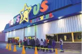  ?? ADOLPHE PIERRE-LOUIS/JOURNAL ?? Customers wait in line to enter WInrock Mall’s Toys R Us on Thanksgivi­ng Day in 2013. The retail chain has filed for bankrupcy.
