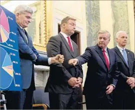  ?? Andrew Harnik Associated Press ?? SENS. BILL CASSIDY, left, Dean Heller, Lindsey Graham and Ron Johnson announce the introducti­on of a sweeping bill to replace the Affordable Care Act.