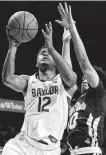  ?? Jerry Larson / Associated Press ?? Jared Butler, left, teams with MaCio Teague to give Baylor a formidable backcourt.