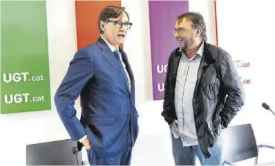 ?? Eric Renom / La Presse ?? El candidato del PSC, Salvador Illa, y el secretario general del sindicato UGT en Catalunya, Camil Ros, ayer.