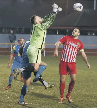  ??  ?? Ryhope CW Jonny Ball gathers a cross at Jarrow Roofing, watched by skipper Leon Ryan. Pics by Tom Banks