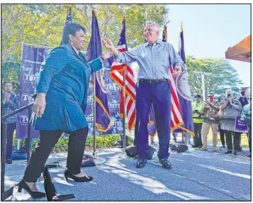  ?? Steve Helber The Associated Press ?? Voting rights activist Stacey Abrams arrives at the stage during a rally Sunday with gubernator­ial candidate, former Virginia Gov. Terry Mcauliffe, in Norfolk, Va.