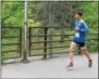  ??  ?? One participan­t making his way over a bridge during the Saratoga Performing Arts Center’s annual Rock & Run fundraiser on Sunday in the Saratoga Spa State Park.