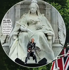  ?? ?? WE ARE AMUSED Brian May emerges from below the statue of Queen Victoria