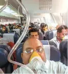  ?? PHOTO: PTI ?? Passengers on board the Mumbai-Jaipur Jet flight after cabin pressure dropped