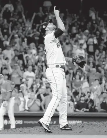  ?? Karen Warren/staff photograph­er ?? Astros closer Ryan Pressly celebrates after putting the finishing touches on Wednesday’s 3-2 victory against the Phillies that was Houston’s 106th of the season, second to the 2019 club’s 107 wins.