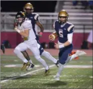  ?? GENE WALSH — DIGITAL FIRST MEDIA ?? La Salle quarterbac­k Sean Daly runs with the ball against Archbishop Wood Friday night.