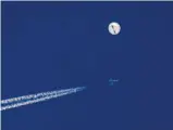  ?? Chad Fish/ Associated Press ?? A fighter jet strikes down a balloon above the Atlantic Ocean, ending its weeklong traverse over the U.S.