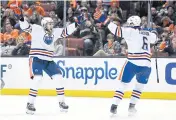  ?? USA TODAY SPORTS ?? Oilers defenceman Adam Larsson, right, celebrates a goal against the Ducks during the third period.