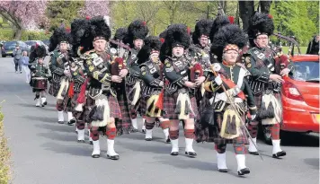  ??  ?? Accrington Pipe Band leading the St George’s Day parade in Great Harwood