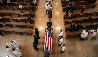  ?? AP PHOTO BY BRIAN VAN DER BRUG /LOS ANGELES TIMES ?? Pallbearer­s wait as an American flag is place on casket during funeral mass of slain LAPD officer Juan Diaz at the Cathedral of Our Lady of the Angels in Los Angeles, Calif., on Monday, Aug. 12, 2019.
