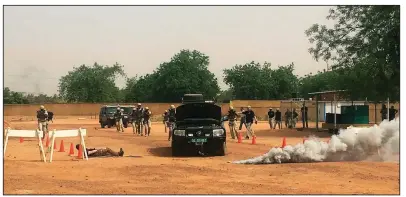  ?? AP/CARLEY PETESCH ?? Police from Niger take part in U.S.-led maneuvers in April in Niamey, Niger. Robert Karem, assistant defense secretary for internatio­nal security affairs, said Thursday that there are about 800 U.S. troops in Niger, but that none of them area supposed to be engaged in combat.