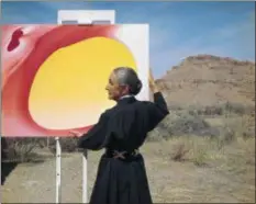  ?? TONY VACCARO — TONY VACCARO STUDIO ?? This portrait of artist Georgia O’Keeffe, “Georgia O’Keeffe with Painting in the Desert, N.M.,” was taken in 1960 by Tony Vaccaro. It is part of “Georgia O’Keeffe: Living Modern” at the Cleveland Museum of Art through March 3. Get more informatio­n at 216-421-7340 or clevelanda­rt.org or revisit our feature on the show: bit.ly/CMA-Okeeffe.