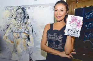  ??  ?? Solenn Heussaff will donate 100 percent of the proceeds from her painting (behind). She is holding the product of an impromptu painting session that she did using make-up.