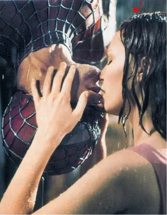  ?? COLUMBIA PICTURES ?? The upside-down kiss in the rain between Spider-Man Tobey Maguire and Kirsten Dunst ranks as a memorable screen kiss, even if it was highly uncomforta­ble for leading man Tobey Maguire.