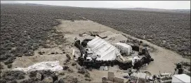  ?? KARL BRENNAN / DRONEBASE ?? This aerial image shows a remote outpost near Amalia, New Mexico, where three siblings and two other adults have been charged with child abuse.