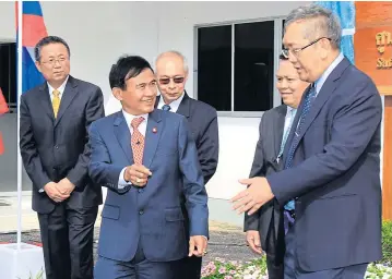  ?? TAWATCHAI KEMGUMNERD ?? Justice Minister Paiboon Koomchaya, centre, is among delegates attending the official opening ceremony of the Safe Mekong Coordinati­on Centre in Chiang Mai. China, Laos and Myanmar have also joined the centre’s operations to crack down on networks of...