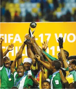  ??  ?? Golden Eaglets players raise the trophy after winning their final match against Mali at the U17 World Cup in Vina del Mar city, Chile on November 8, 2015. Photo: