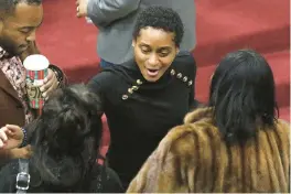  ?? ?? County Assessor Latanya Spearman greets family and friends after the ceremony.