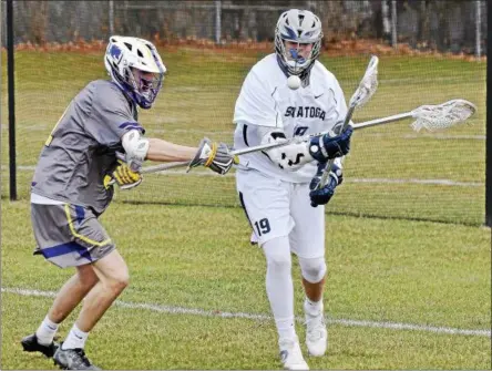  ?? STAN HUDY - SHUDY@DIGITALFIR­STMEDIA.COM ?? Ballston Spa defense Tyler Beverly knocks the ball out of Saratoga’s Graham Patten’s stick Thursday afternoon behind Saratoga Springs High School.