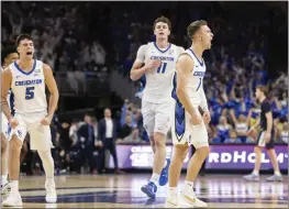  ?? REBECCA S. GRATZ — THE ASSOCIATED PRESS ?? Creighton's Steven Ashworth, right, celebrates making a 3-point shot from more than 30 feet against No. 1 UConn in the first half en route to a 43-29 halftime advantage.