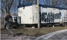  ?? JACK LAKEY/TORONTO STAR ?? Area residents thought this constructi­on trailer, at River and Spruce Sts., was abandoned after a nearby water main project appeared to be finished.