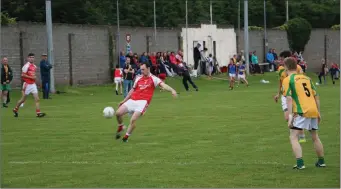  ??  ?? Knockanann­a’s Keith Corrigan fires off a shot for a point during the JBFc clash with Dunlavin.